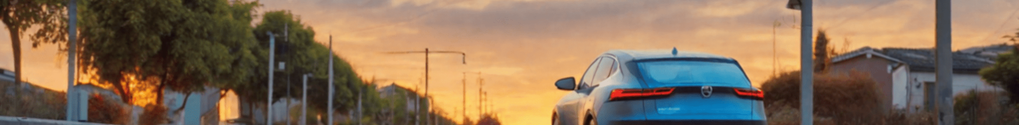 electric-car-in-the-distance-from-the-back–drives-in-street-with-sunset-646322568 electric-car-in-the-distance-from-the-back--drives-in-street-with-sunset-646322568